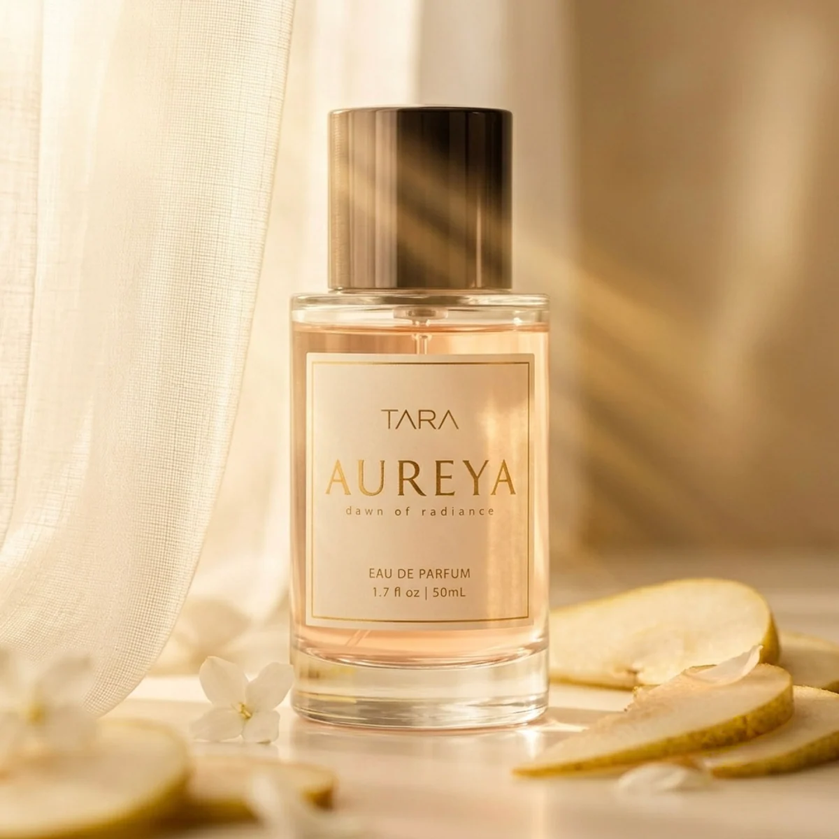 Aureya perfume bottle in warm morning light with soft pear and floral styling.